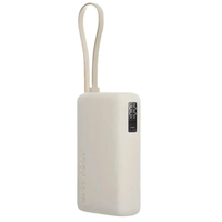Power bank Xiaomi PB100DPW 10000 mAh, carga 67 W, cable USB-C integrado, 3 salidas, beige